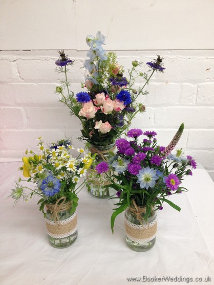 Table Centrepiece made up of 3 jam jars of just picked wild country style flowers
