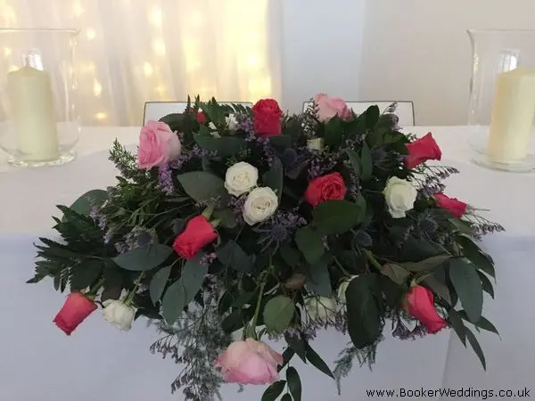 Top Table Arrangement in Hot Pink Lilac an White
