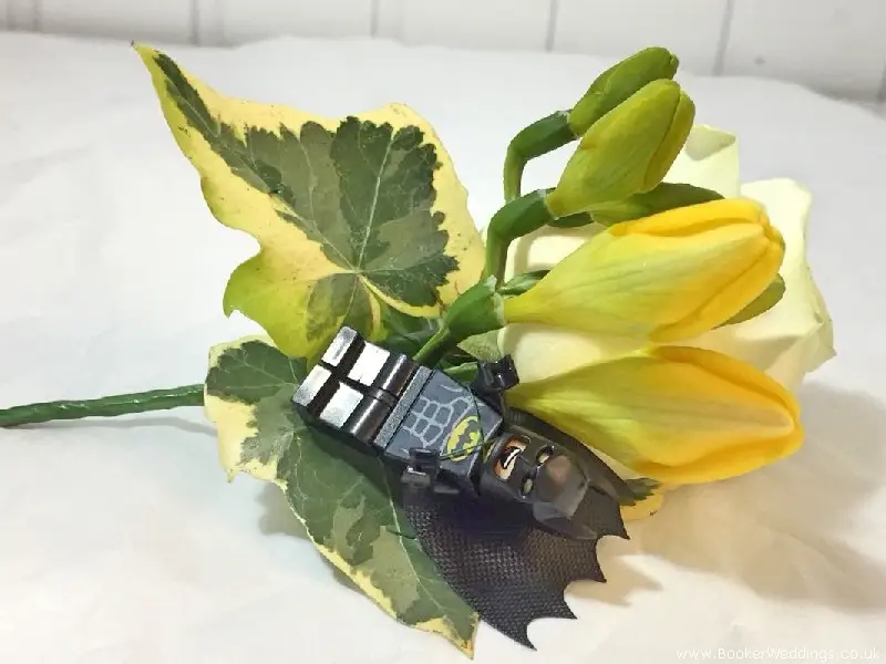 Groom buttonhole featuring Batman LEGO man, rose and freesia