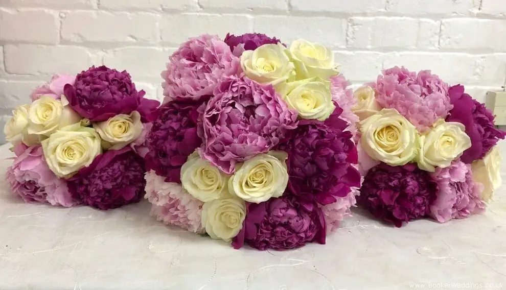 Bride and Bridesmaids matching Handtied Bouquets of Roses and Peonies