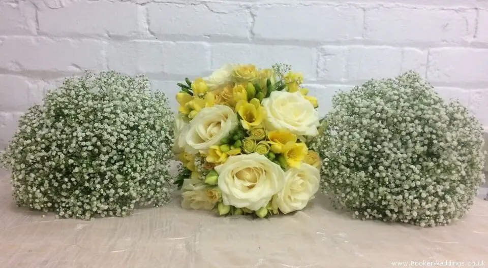 Bridal bouquet in yellow and cream and gypsy grass bridesmaids bouquets
