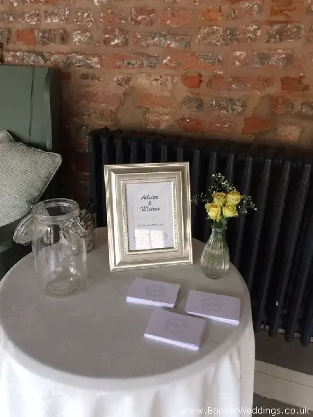 Wedding venue flowers in glass jars