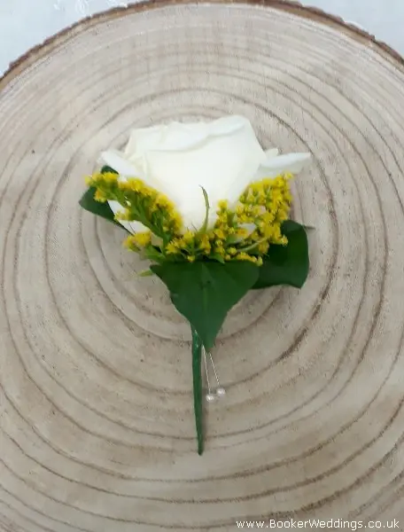 White Rose and Yellow Solidaster Buttonhole for Groom