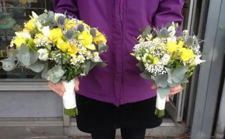 Yellow and Blue Flowers Bride and Bridesmaid Bouquets Side View with eryngium, daisy, spray rose, lisianthus and freesias