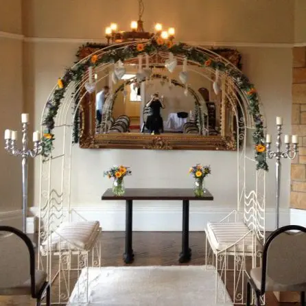 Yellow and Blue Archway Decoration Gerbera Craspedia Eryngium and Gypsophilia
