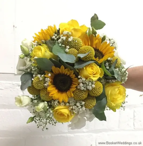 Bridal handtied bouquet in yellow and creams with yellow sunflowers, craspedia, roses, gypsy grass, lissanthus and grey eucalyptus